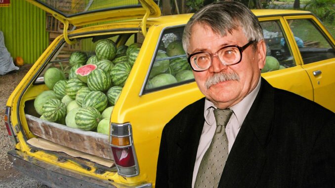 Math professor standing in front of car loaded with watermelons